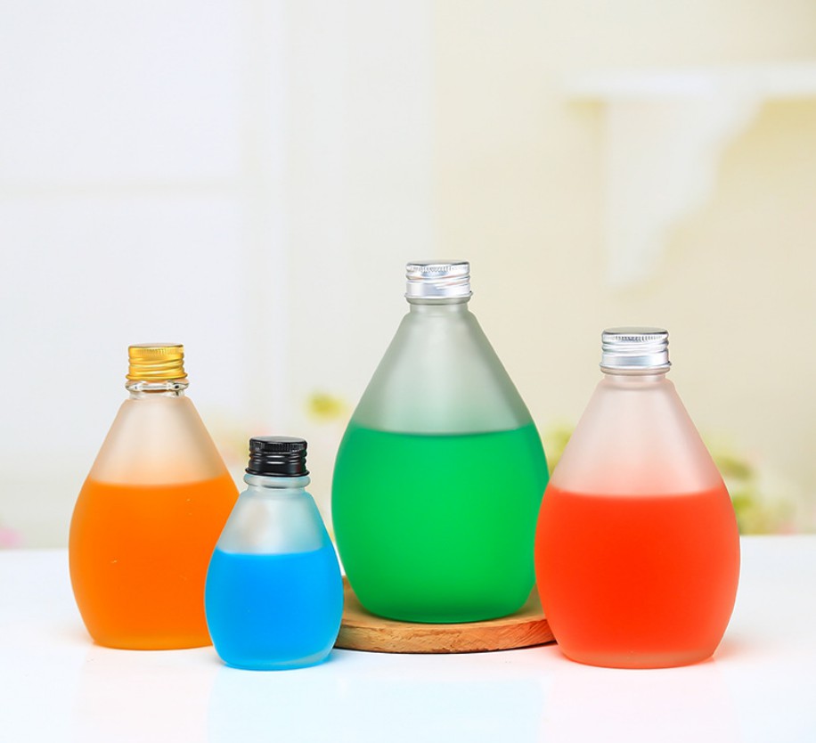Les gouttelettes d'eau conçoivent les bouteilles en verre de boisson de jus KDG Factory
